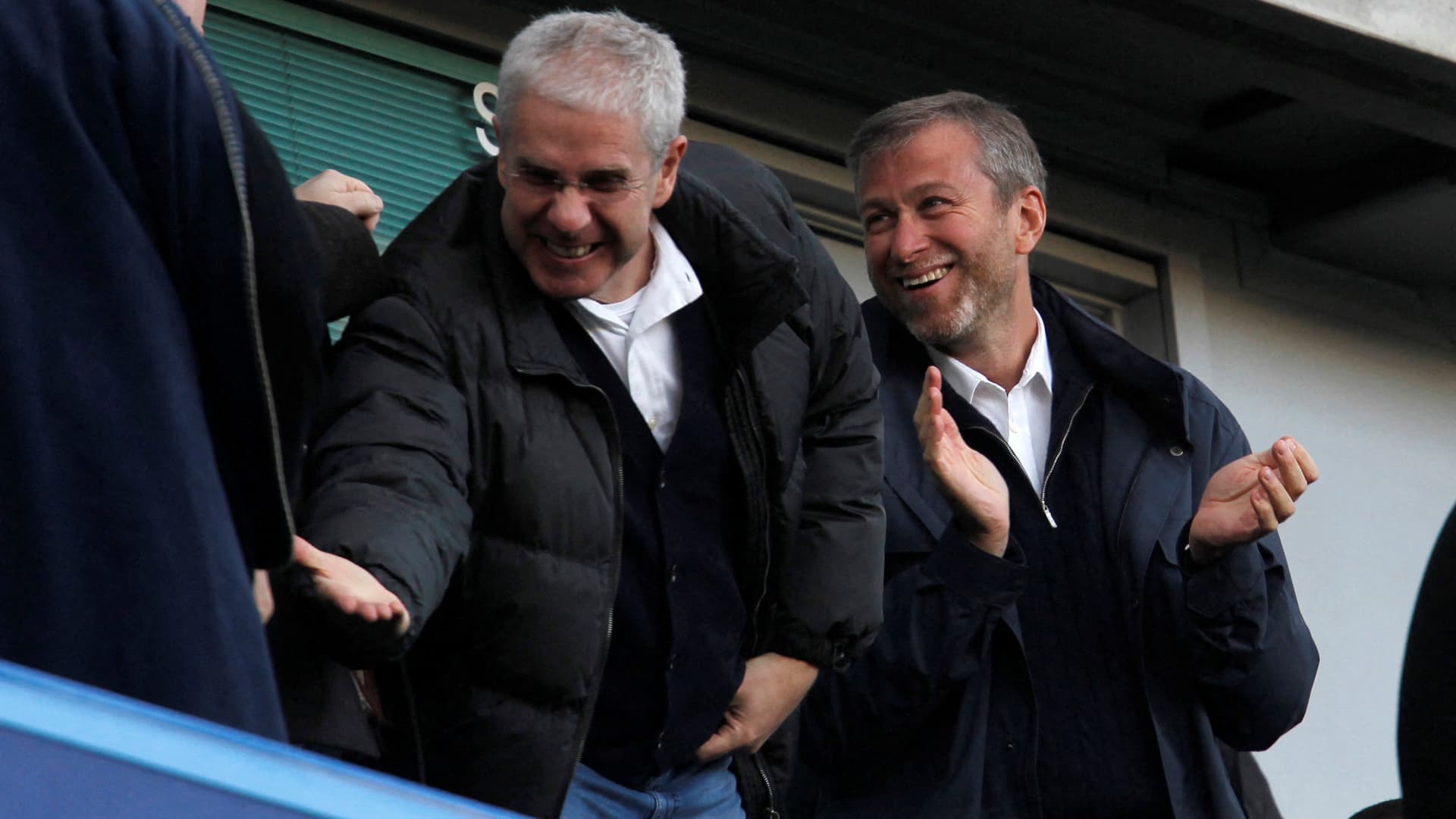 Chelsea owner Roman Abramovich (R) and director Eugene Tenenbaum (L) celebrate a goal for Chelsea v Bolton Wanderers in Barclays Premier League February 25, 2012.