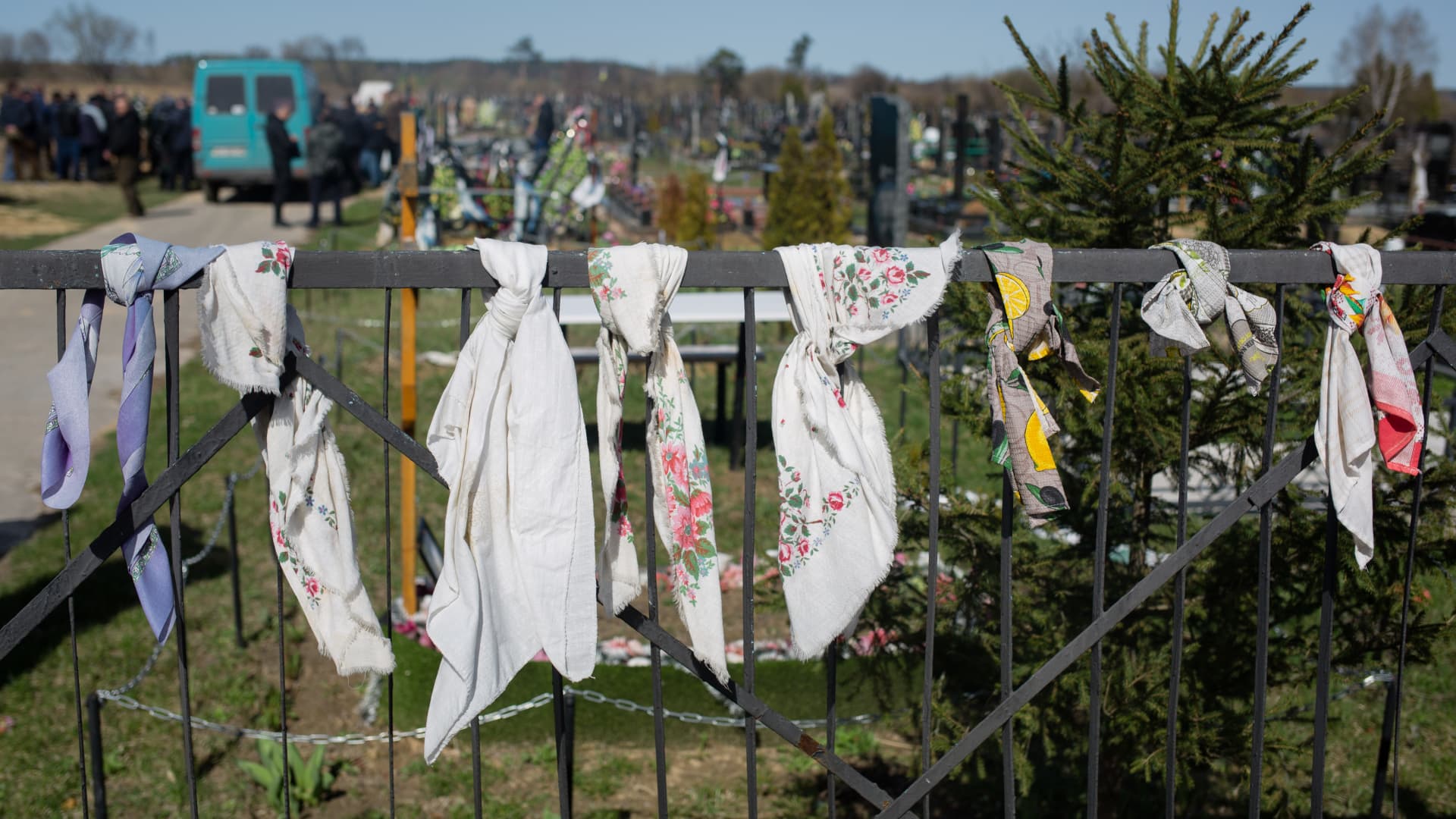The funeral scarfs hang on the cemetery fence on April 14, 2022 in Hostomel, Ukraine.