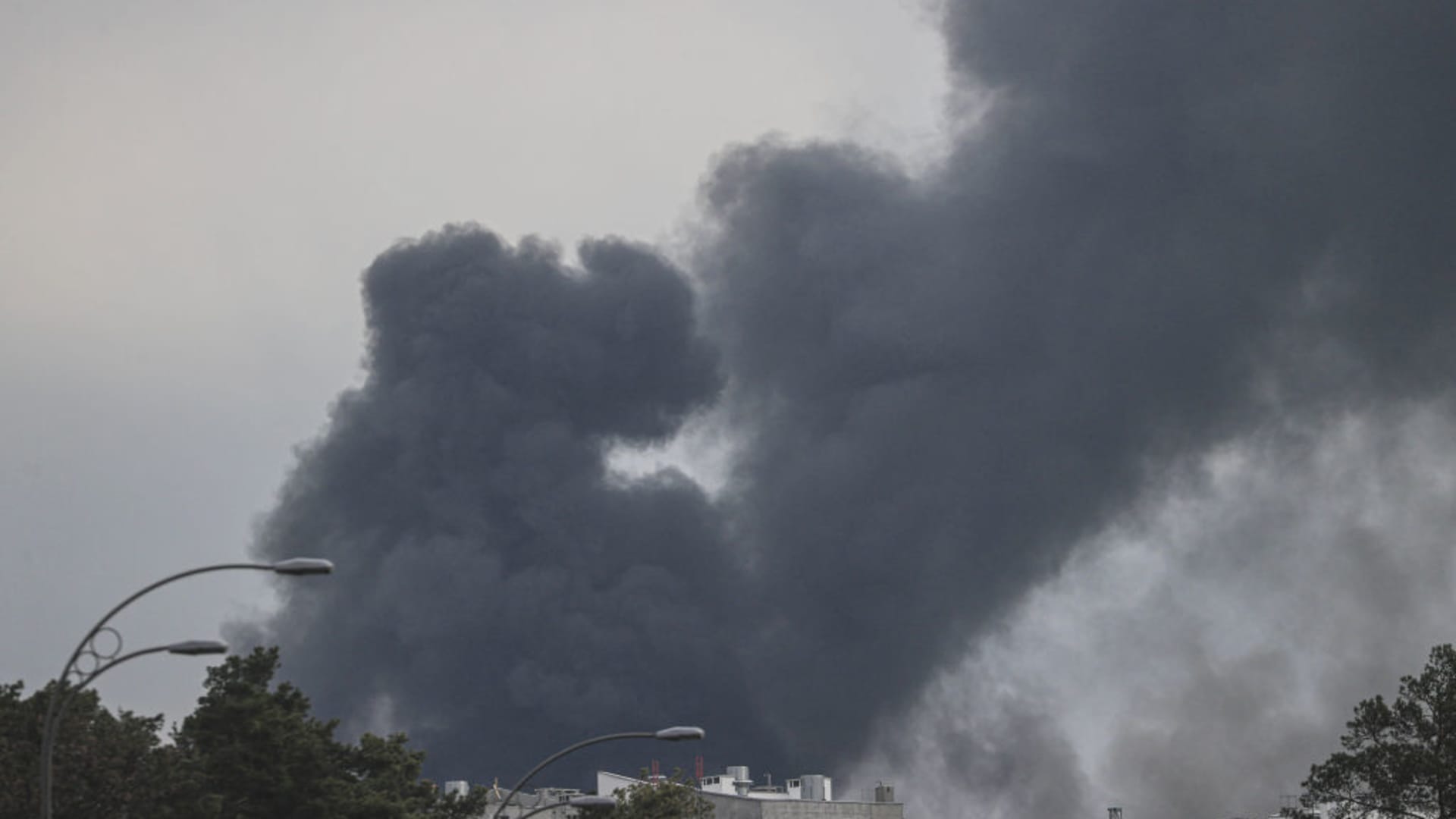 Smoke is seen rising over Darnytskyi District of Kyiv, Ukraine on April 16, 2022.