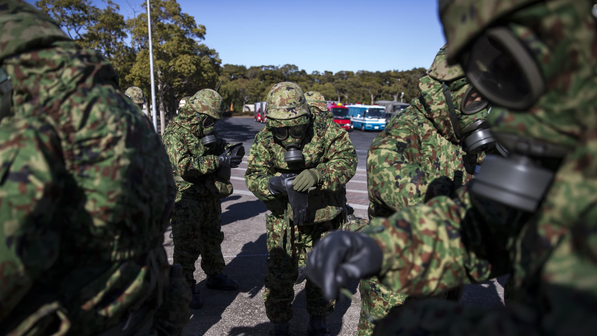 Members of the Japan Ground Self-Defense Force wearing masks prepare for a sarin attack drill on Wednesday, Jan. 24, 2018. Japan announced on Tuesday it is sending Ukraine masks and clothing designed to protect against chemical weapons, as well as drones.