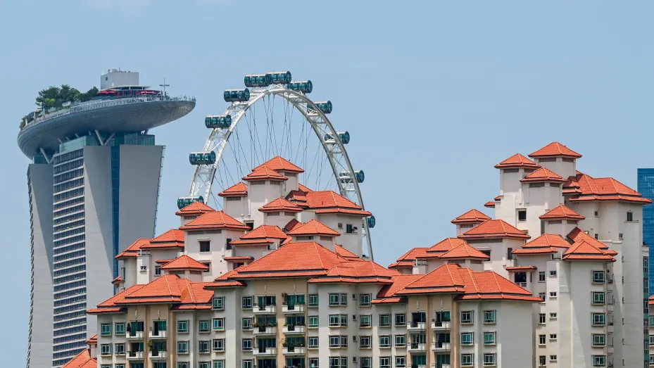 Private apartments are seen against the backdrop of the Marina Bay Sands hotel (back L) and the Singapore Flyer observatory wheel in Singapore on March 23, 2022.
