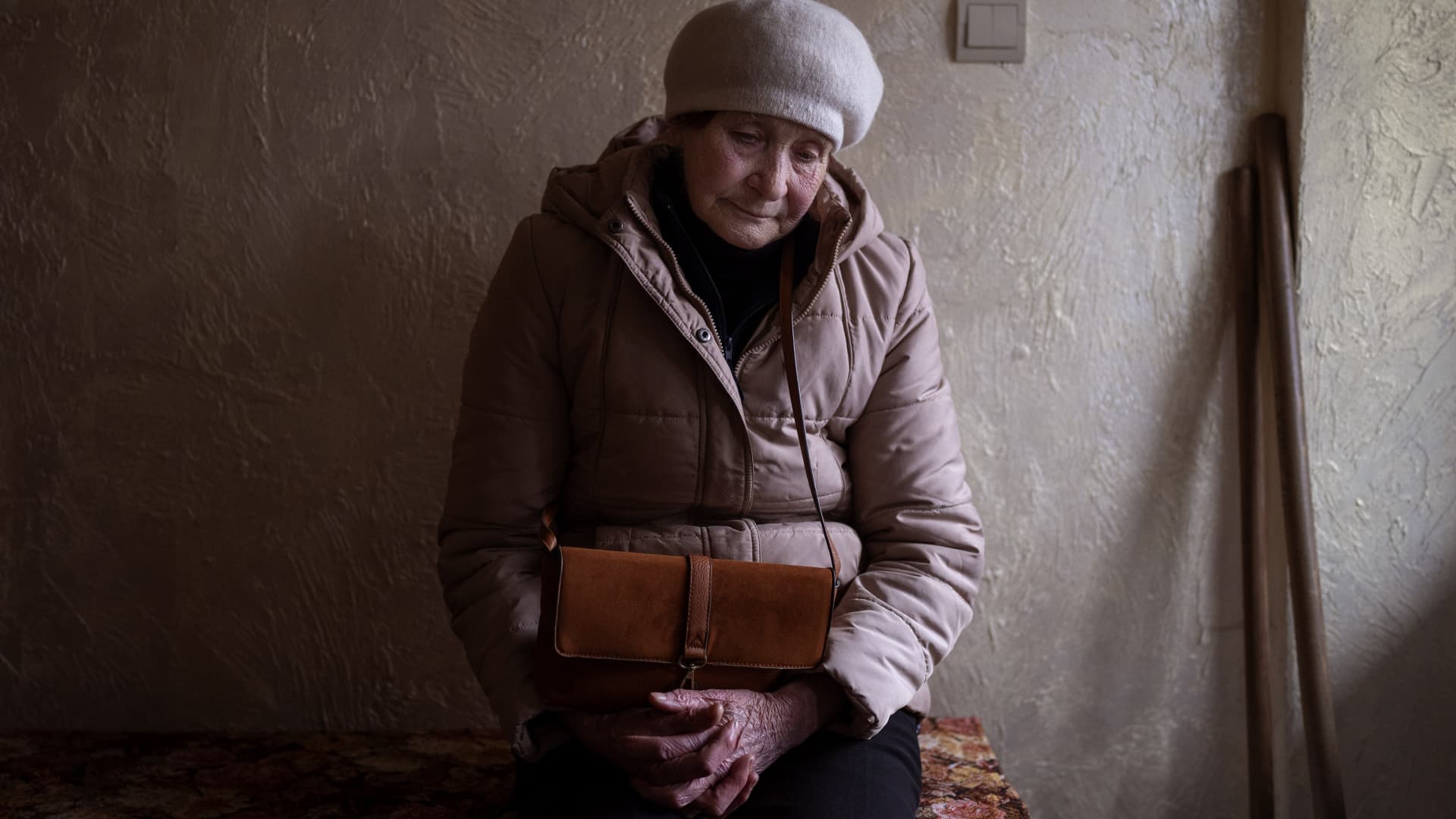 Nina, 77, waits her turn inside a church to receive humanitarian aid donated by European Union in Bucha, on the outskirts of Kyiv, Tuesday, April 19, 2022. Citizens of Bucha are still without electricity, water and gas after more than 44 days since the Russian invasion began.