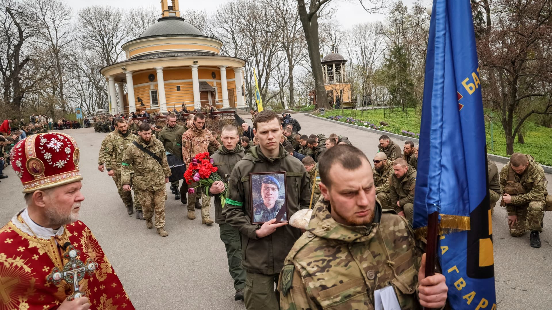 Servicemen of the Ukrainian National Guard attend the funeral of the four of their fellow servicemen, who were killed during Russia's invasion of Ukraine, in Kyiv, Ukraine, April 20, 2022.