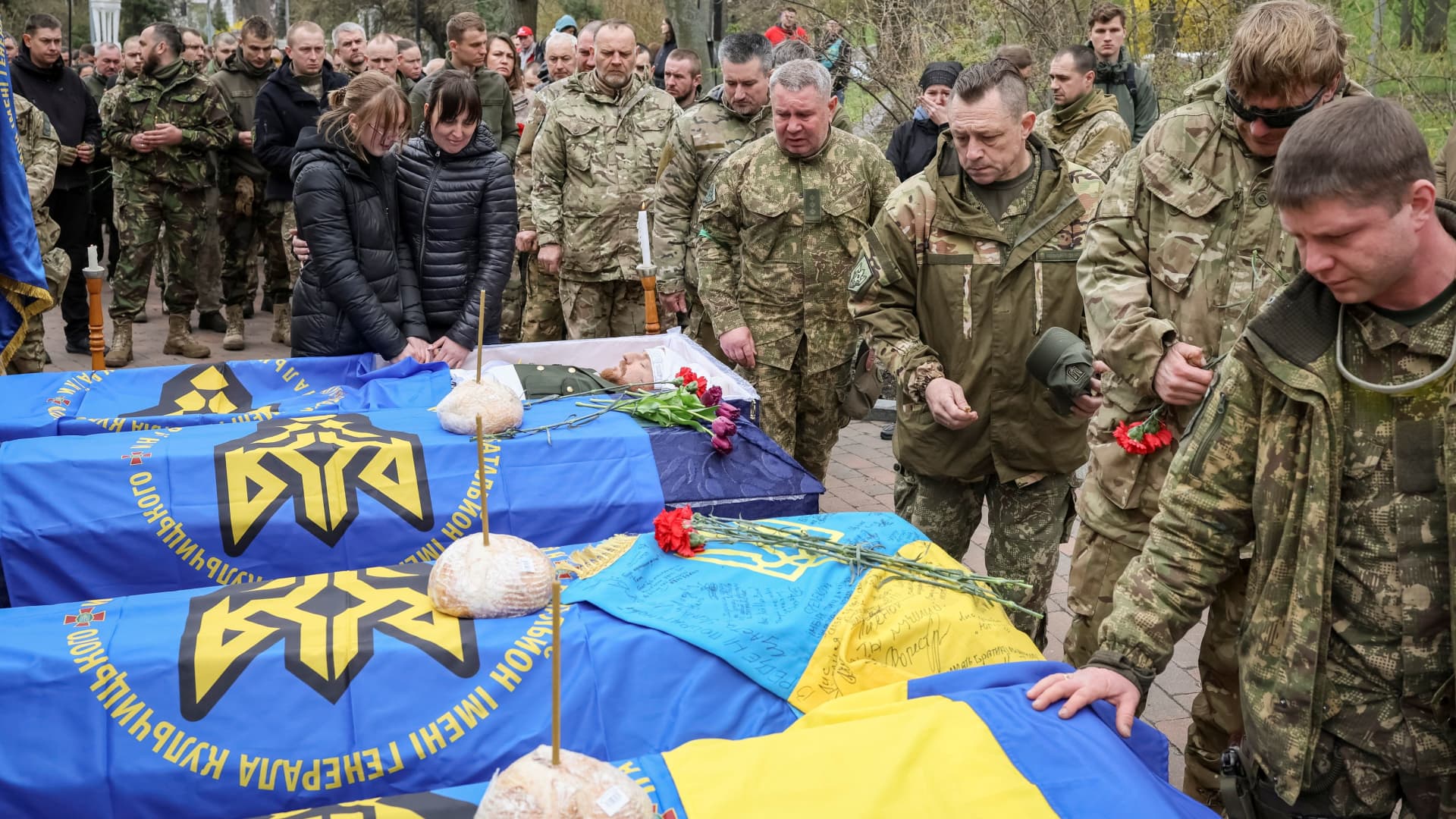 Servicemen of the Ukrainian National Guard attend the funeral of the four of their fellow servicemen, who were killed during Russia's invasion of Ukraine, in Kyiv, Ukraine, April 20, 2022.