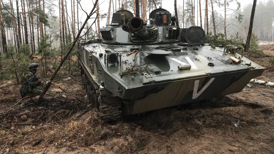 A Russian tank seized inside of the woodland is examined by Ukrainian soldiers in Irpin, Ukraine on April 01, 2022.