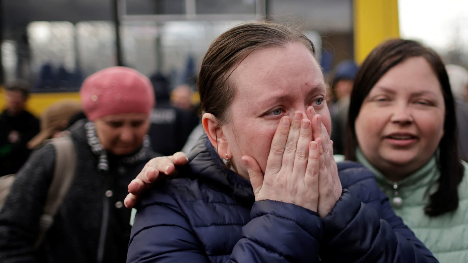 A Ukrainian refugee from Mariupol area cries after arriving in a small convoy that crossed through a territory held by Russian forces, after the opening of a humanitarian corridor, at a registration center for internally displaced people, amid Russia's invasion of Ukraine, in Zaporizhzhia, Ukraine April 21, 2022.