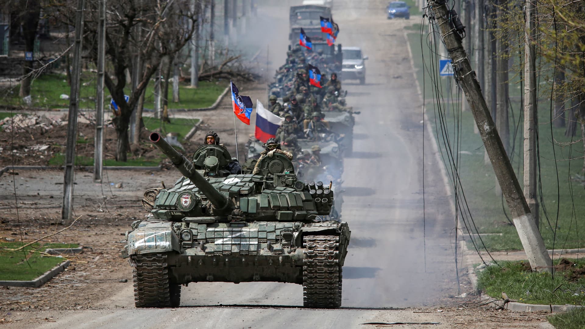 An armored convoy of pro-Russian troops moves along a road during the Ukraine-Russia conflict in the southern port city of Mariupol, Ukraine, on April 21, 2022.