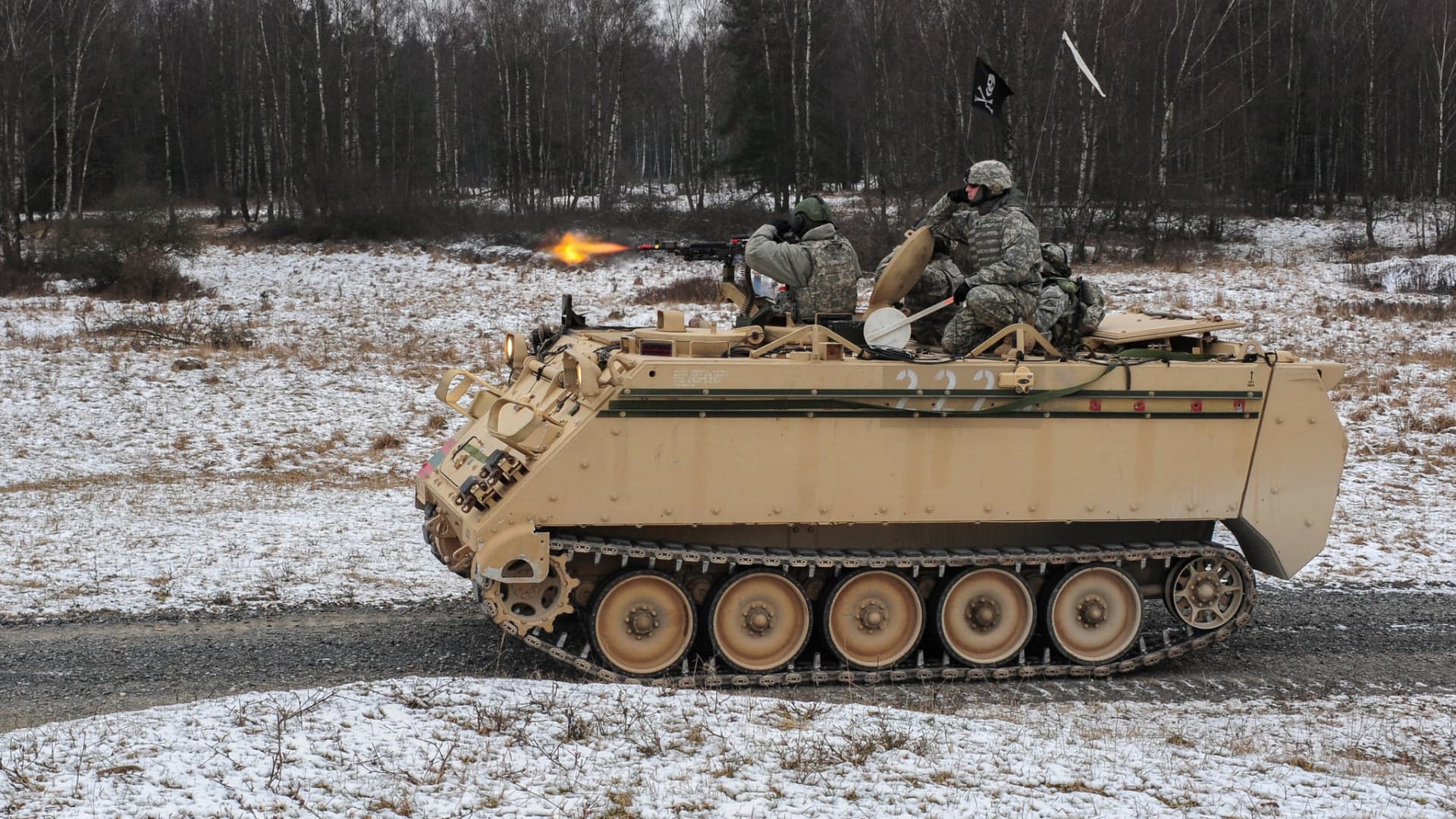 U.S. Army Soldiers, assigned to Bravo Company, 1st Battalion, 4th Infantry Regiment, engage a target from a M113A2 armored vehicle during squad maneuver training at Grafenwoehr Training Area on Jan. 14, 2013.