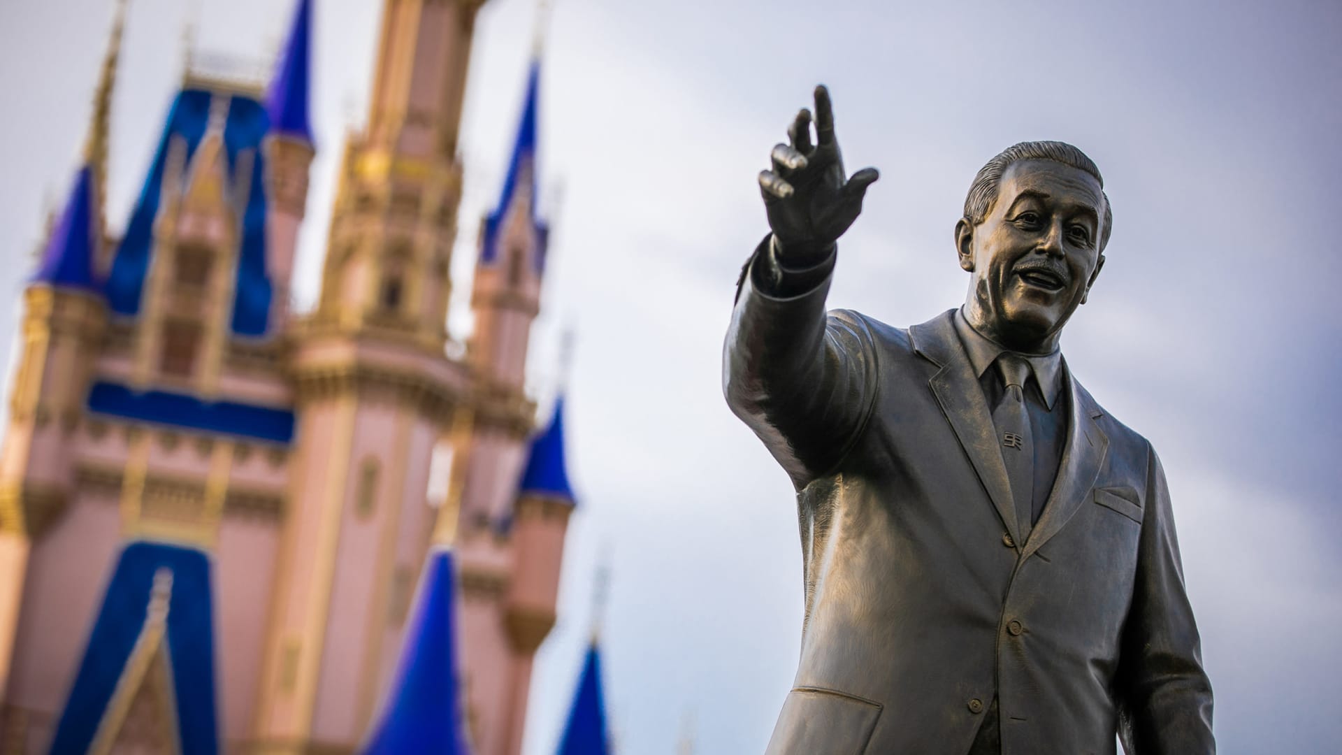 View of the Walt Disney statue in front of Cinderella Castle inside the Magic Kingdom Park at Walt Disney World Resort in Lake Buena Vista, Florida.