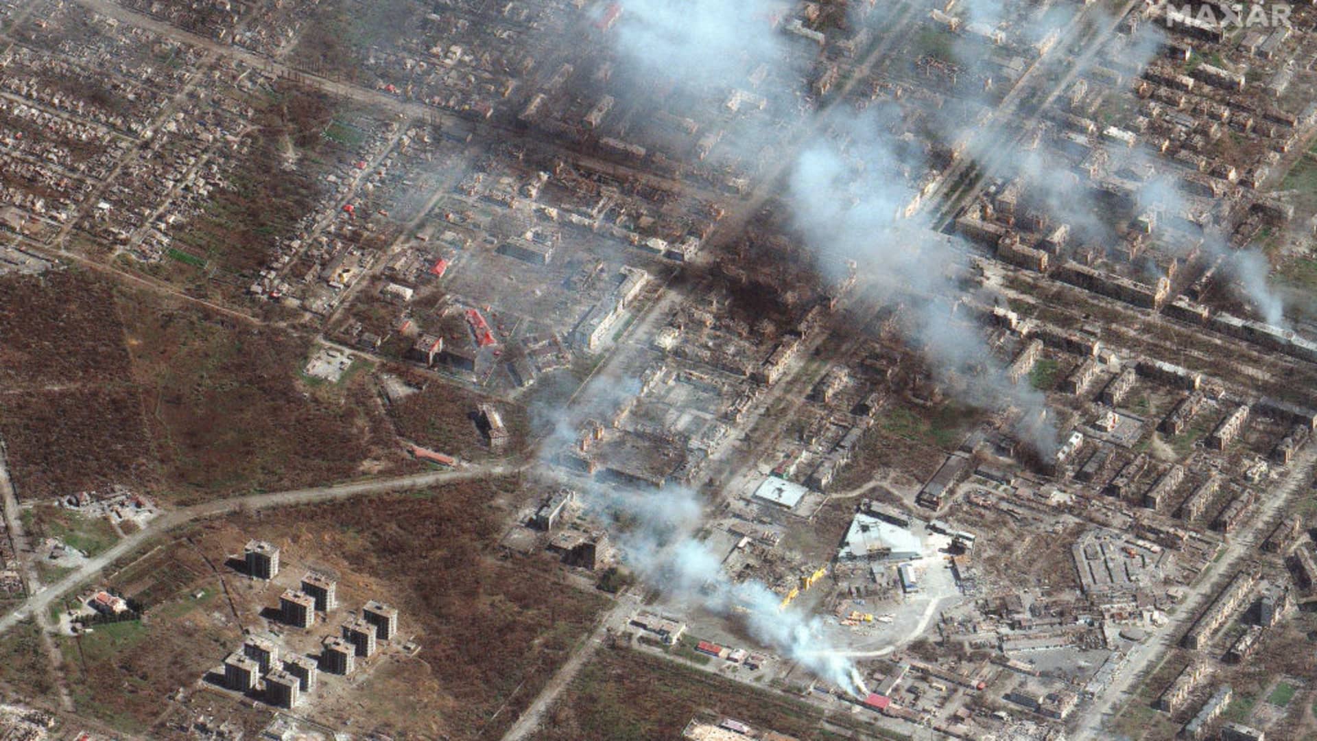 Maxar satellite imagery of buildings on fire in eastern Mariupol, Ukraine on April 9, 2022.