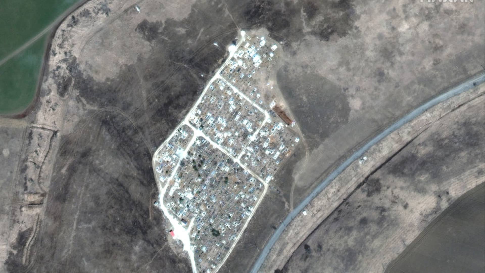 Maxar satellite imagery of another mass grave site expansion just outside of Vynohradne, Ukraine, just east of Mariupol.