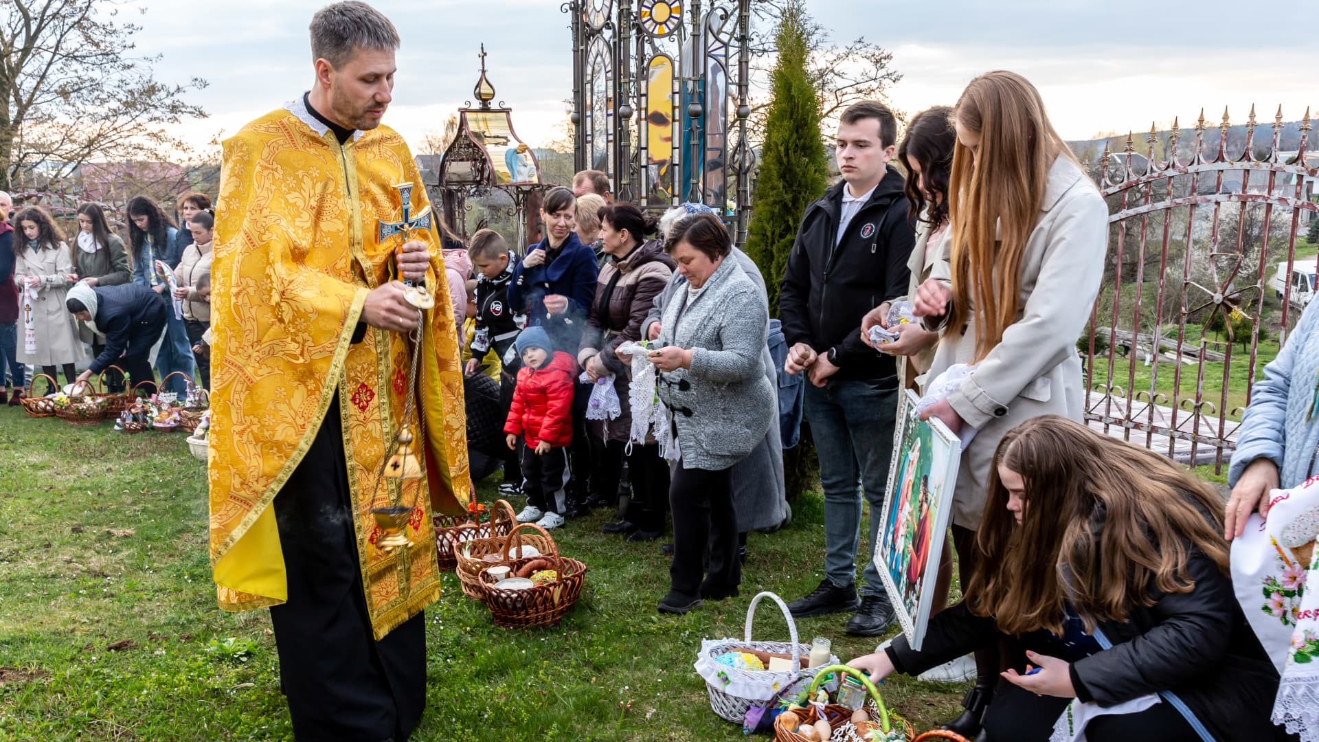 Dozens of Ukrainians attending the Holy Saturday traditional food basket blessing ceremony in Greek-Catholic church in Nadyby, Lviv Oblast, Ukraine on April 23, 2022.