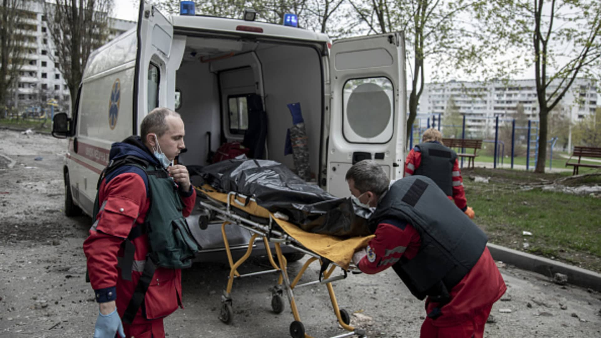 Paramedics carry the body of a resident to an ambulance as it was recovered from under the rubble in the Saltivka neighborhood in Kharkiv, Ukraine, April 24th, 2022.