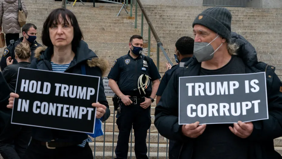 Anti-Trump demonstrators gather outside of the New York County Supreme Court in New York City, U.S., April 25, 2022. REUTERS/David 'Dee' Delgado