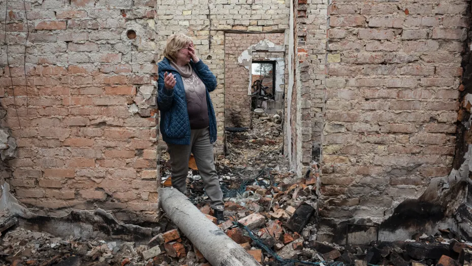Inna, 53, cries inside her burnt house on April 25, 2022 in Ozera, Ukraine. The towns around Kyiv are continuing a long road to what they hope is recovery, following weeks of brutal war as Russia made its failed bid to take Ukraine's capital.