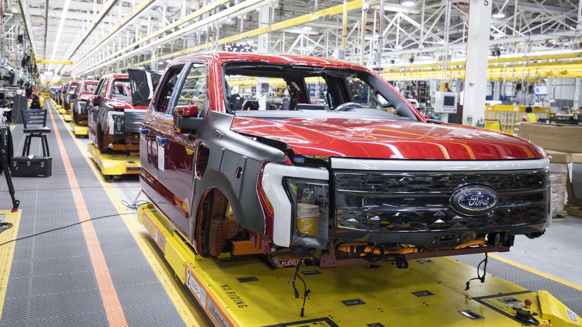 Ford F-150 Lightning pickup trucks sit on the production line at the Ford Rouge Electric Vehicle Center on April 26, 2022 in Dearborn, Michigan.