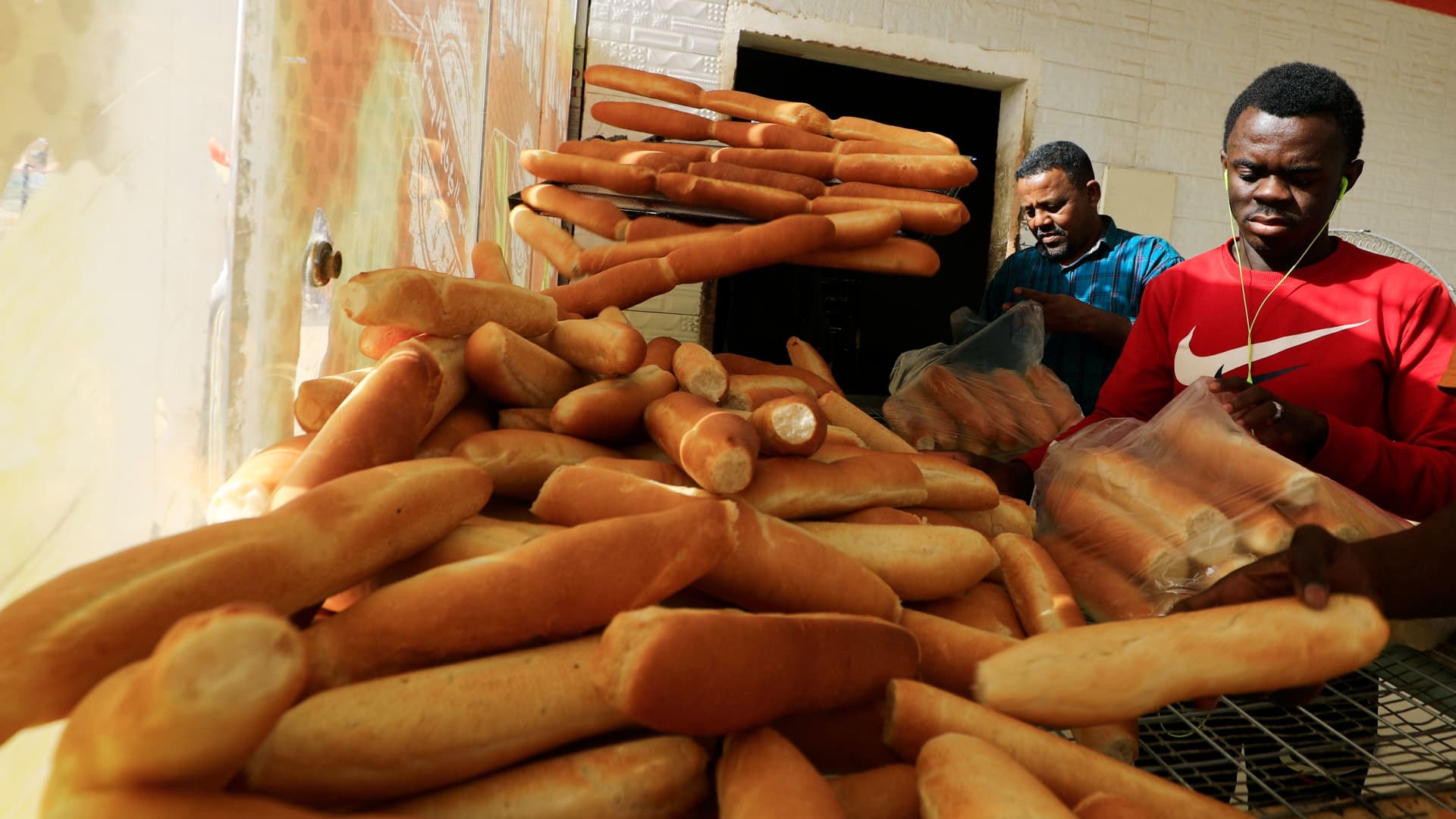Employees package bread at a bakery in Khartoum's al-Matar district, on March 17, 2022 as food prices rise across Sudan and the region due to the conflict in Ukraine.