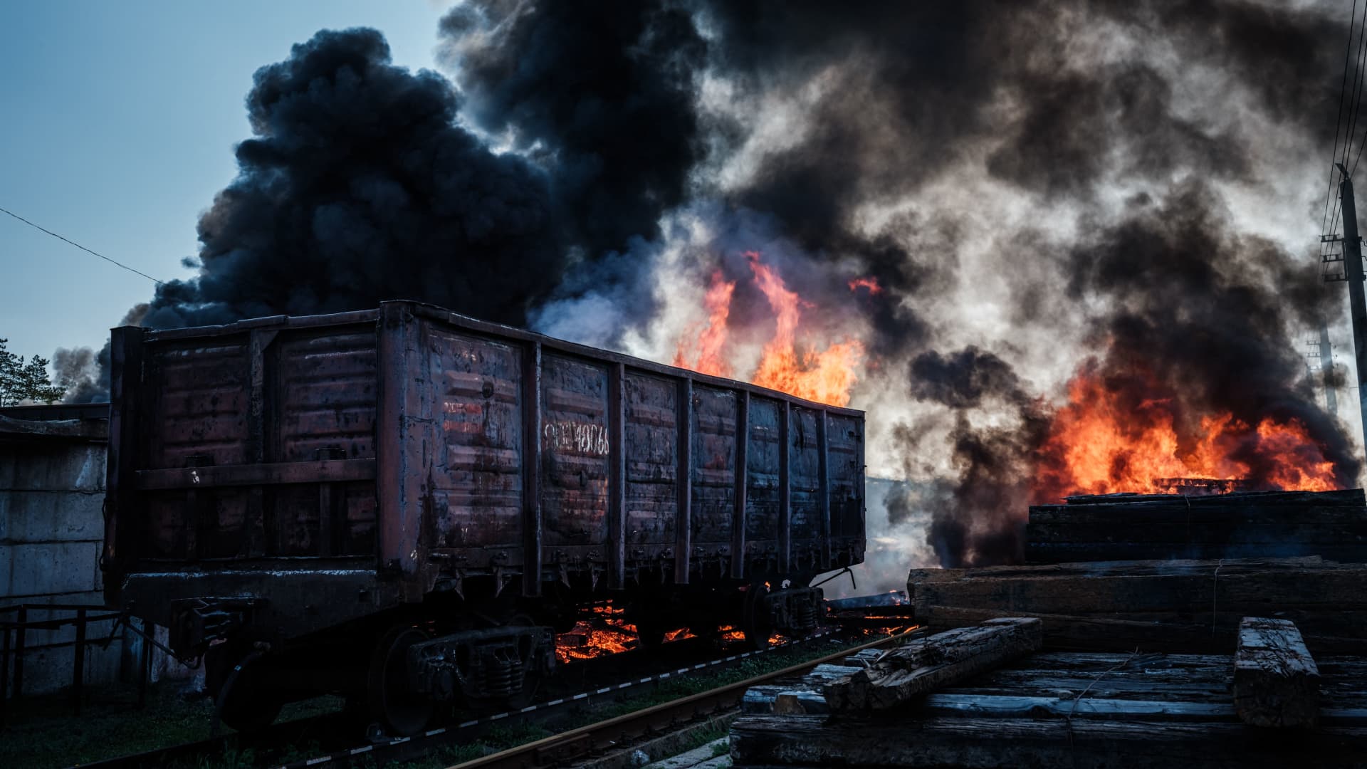 This photograph shows a railway wagon and sleepers burning after a shelling near the Lyman station in Lyman, eastern Ukraine, on April 28, 2022, amid the Russian invasion of Ukraine.