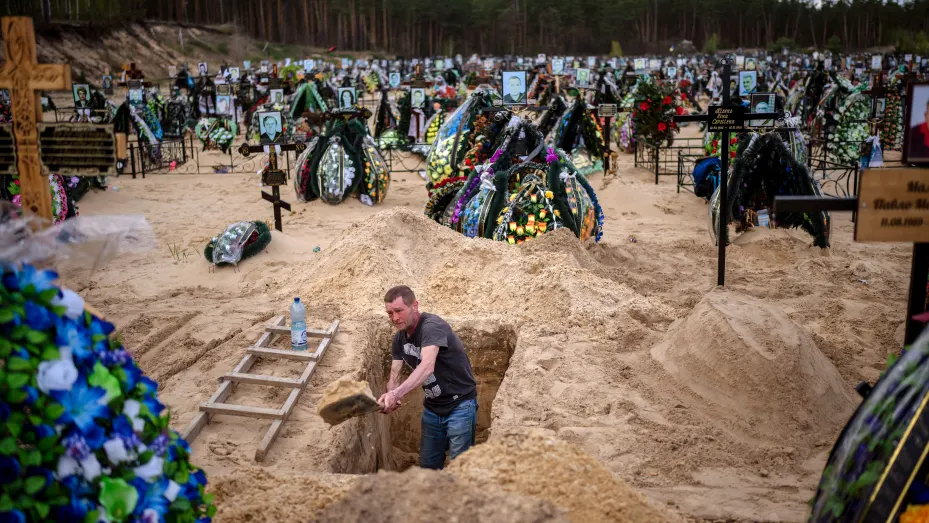 Gravedigger Alexander, digs a grave at the cemetery of Irpin, on the outskirts of Kyiv, on Wednesday, April 27, 2022.