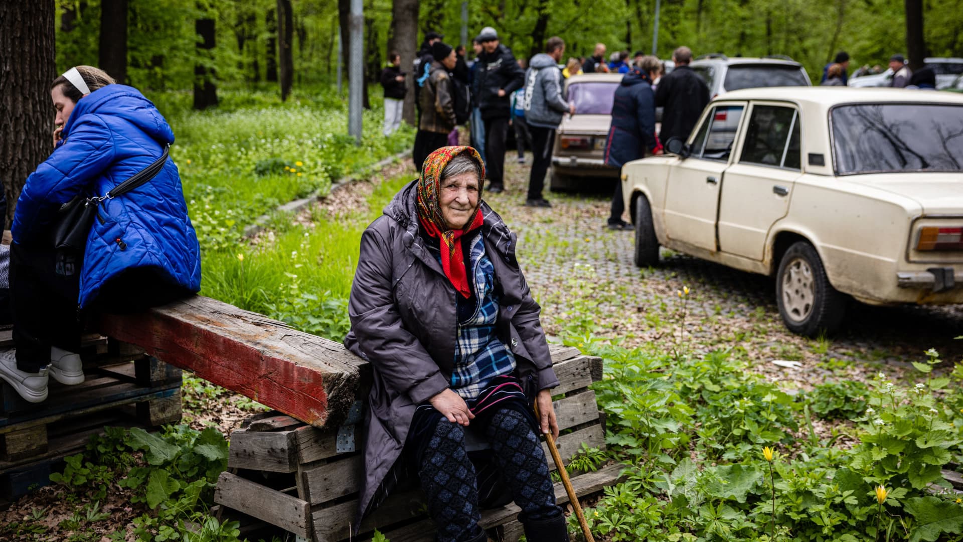 A ederly woman, who fled from the village of Ruska Lozova, rests at the evacuation point in Kharkiv, eastern Ukraine, on April 29, 2022, on the 65th day of the Russian invasion of Ukraine. Several hundred residents of key village Ruska Lozova arrived in Kharkiv on April 29, 2022 morning, after being evacuated from this village taken over overnight by the Ukrainian army, after having been under Russian control for two months.