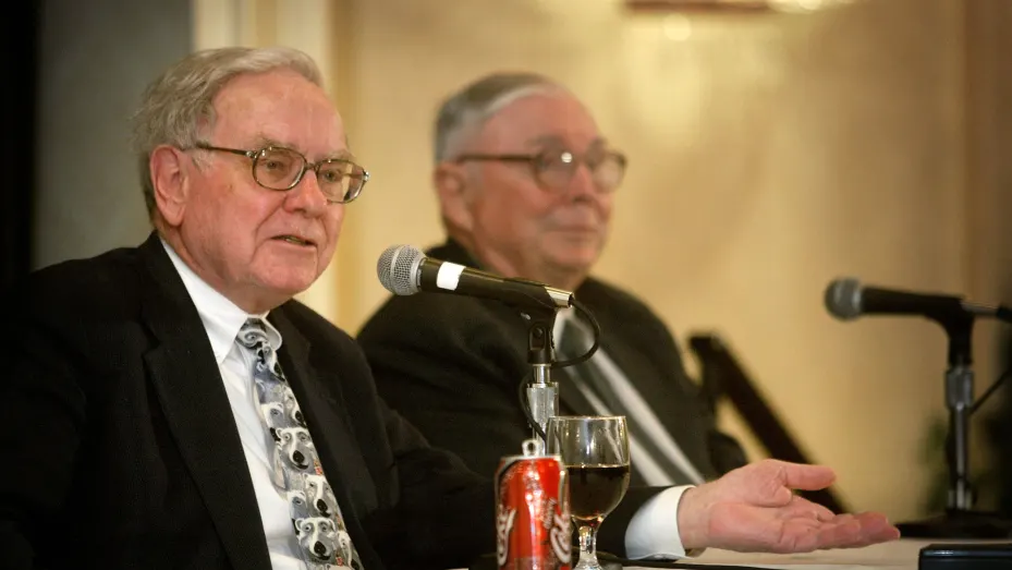 Berkshire Hathaway's CEO Warren Buffett (L) and his business partner Vice Chairman Charles Munger answer questions at a news conference May 4, 2003 in Omaha, Nebraska.