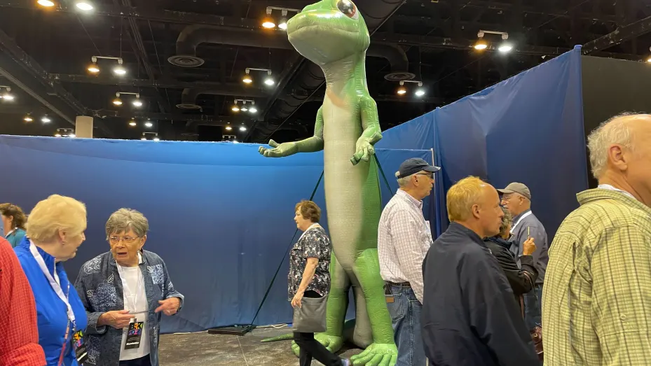 Display showing Gecko character for GEICO Insurance during the Berkshire Hathaway Annual Shareholder Meeting in Omaha, Nebraska.
