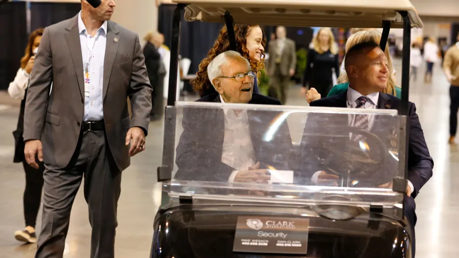 Warren Buffett rides in a cart at the Berkshire Hathaway Annual Shareholders Meeting in Omaha, Nebraska, April 29, 2022.