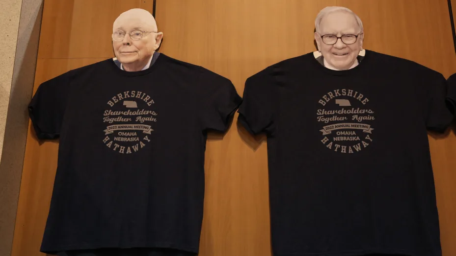 Charles Munger and Warren Buffet faces in Berkshire Hathaway T-Shirts at the Berkshire Hathaway Annual Shareholders Meeting in Omaha, Nebraska.
