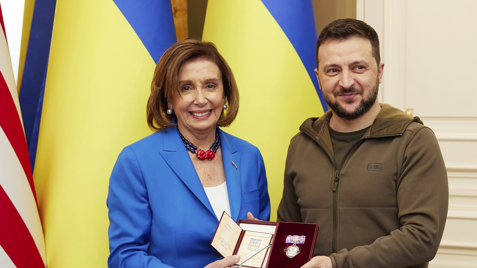 Ukrainian President Volodymyr Zelenskyy, right, awards the Order of Princess Olga, the third grade, to U.S. Speaker of the House Nancy Pelosi in Kyiv, Ukraine, Saturday, April 30, 2022.