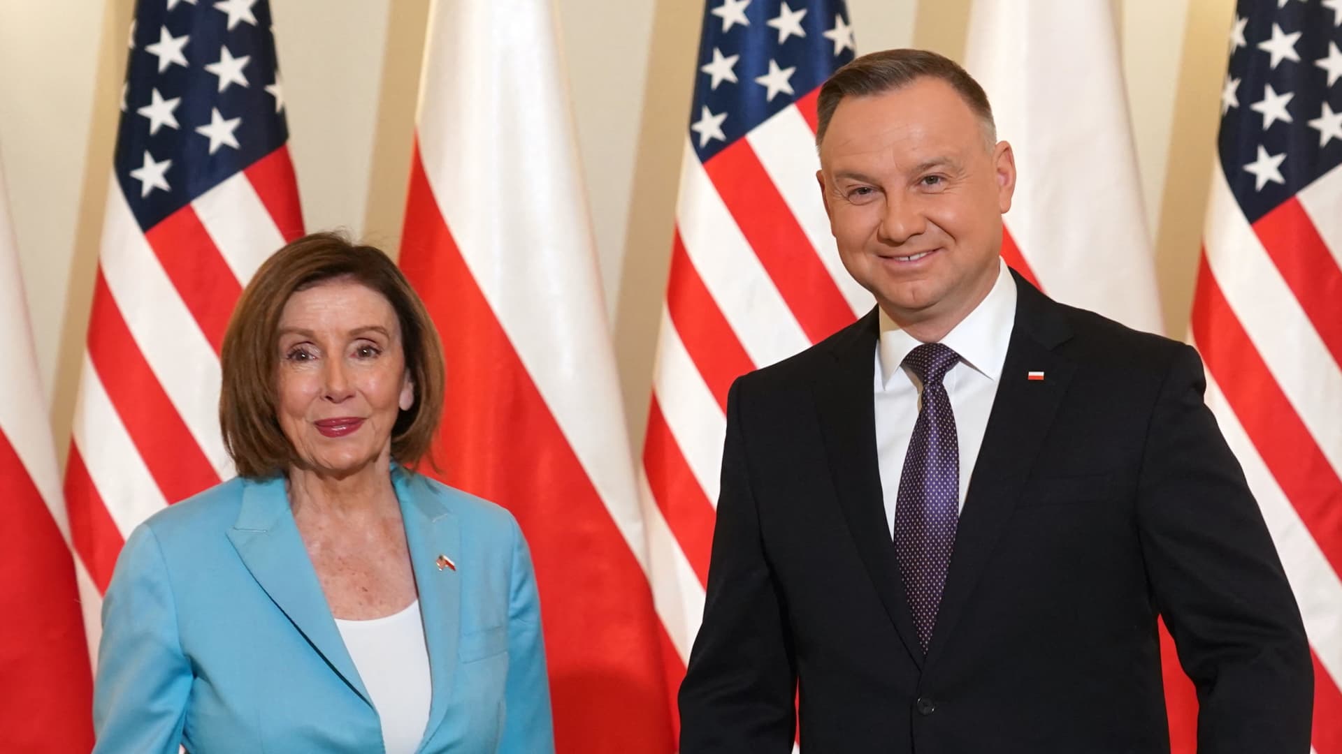 US Speaker of the House Nancy Pelosi stands next to Polish President Andrzej Duda as they meet in Warsaw on May 2, 2022.