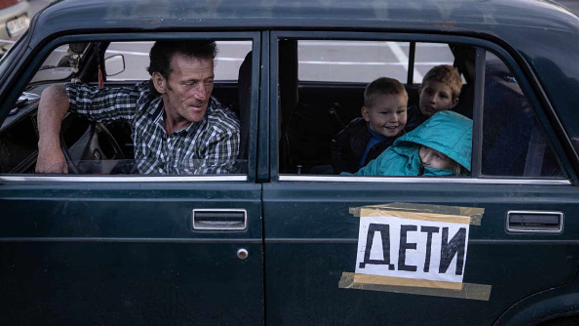 A family from Mariupol wait in their car to be registered by police after arriving at an evacuation point for people fleeing Mariupol, Melitopol and the surrounding towns under Russian control on May 02, 2022 in Zaporizhzhia, Ukraine.
