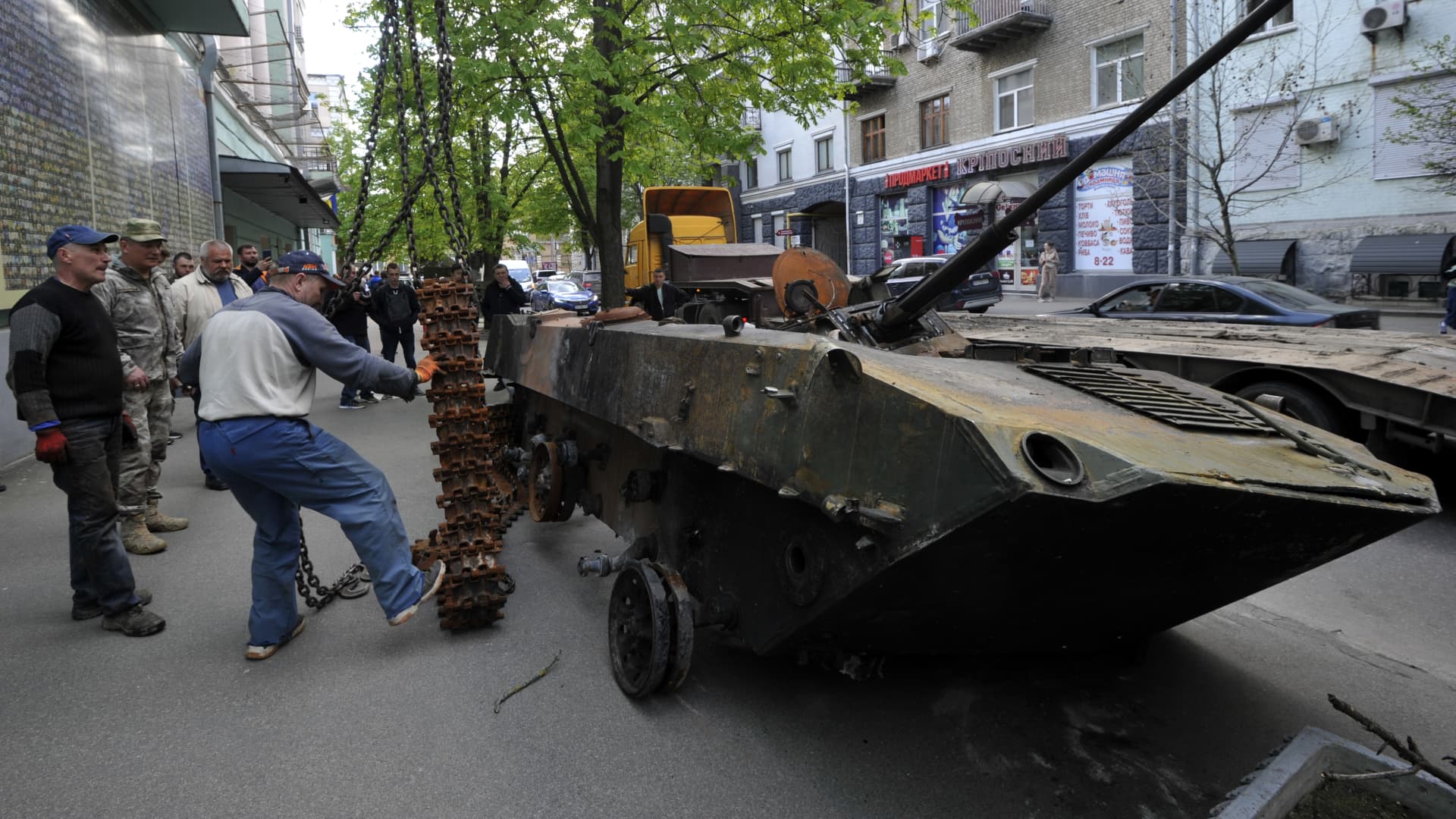 Workers install a destroyed Russian BMD-2 (Airborne Fighting Vehicle) near the military museum in Kyiv to showcase to passersby. It was destroyed by the Ukrainian military in the Kiyv region then brought into Kyiv for display. 