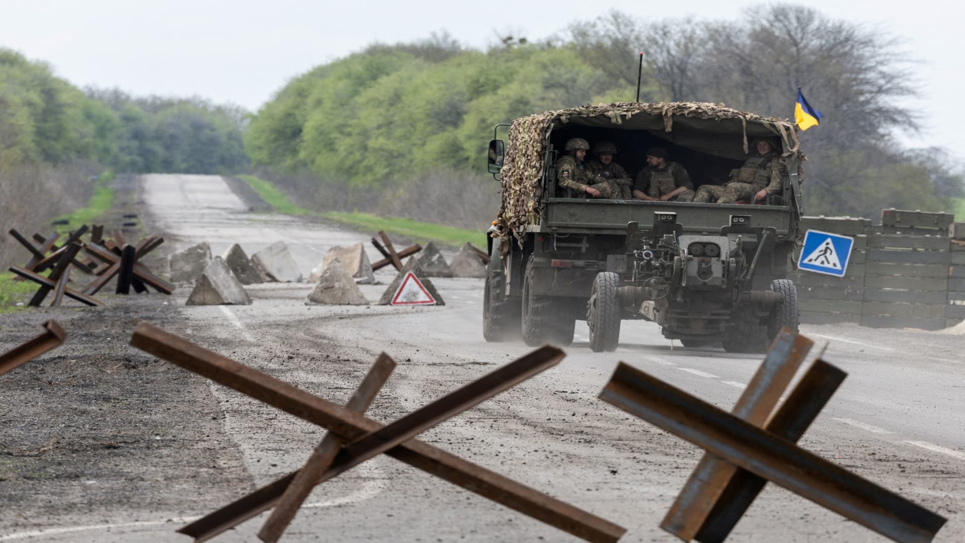 A Ukrainian military vehicle drives to the front line during a fight, amid Russia's invasion in Ukraine, near Izyum, Kharkiv region, Ukraine, April 23, 2022. 