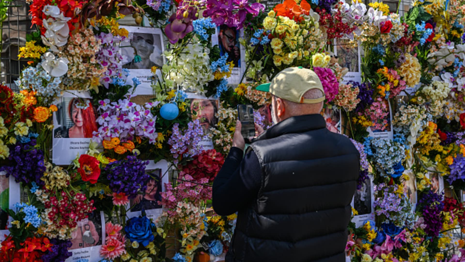 A man views the flower memorial wall in memory of the victims of Russia's attacks in Lviv, Ukraine on May 03, 2022. 