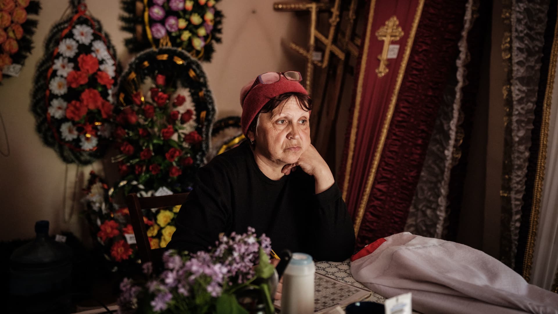 Antonina, 60, sits at a funeral home where she works and now lives in as a shelter with neighbours in Severodonetsk, eastern Ukraine, eastern Ukraine, on May 3, 2022, as fighting is raging across Ukraine's east amid a US warning that Moscow is preparing to formally annex eastern regions.