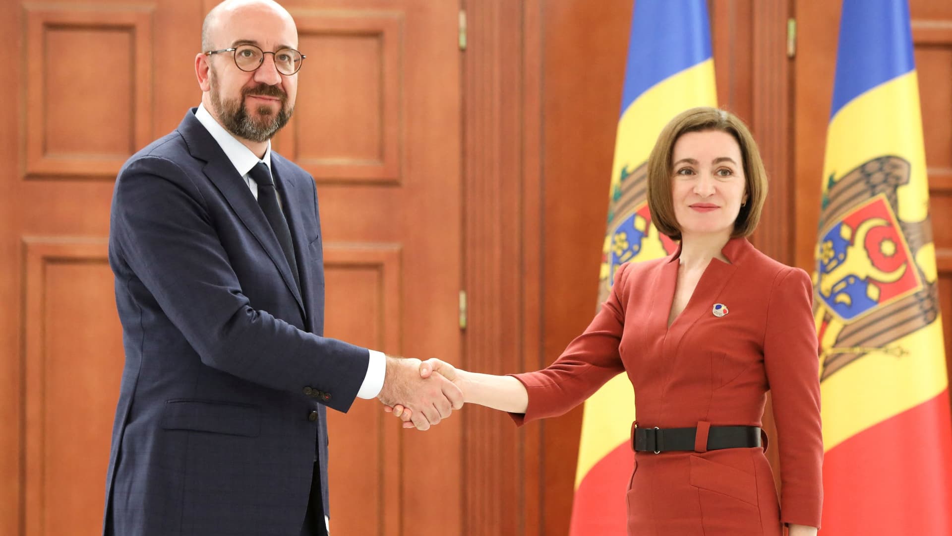 Moldovan President Maia Sandu shakes hands with European Council President Charles Michel during a meeting in Chisinau, Moldova May 4, 2022. 