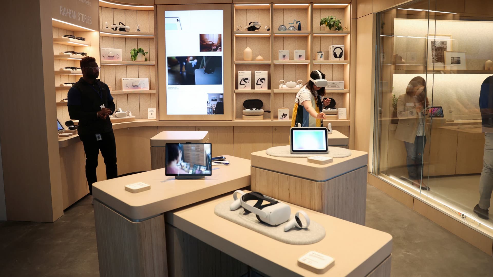 Meta team members stand ready to offer help demonstrating the different spaces during a preview of the inaugural physical store of Facebook-owner Meta Platforms Inc in Burlingame, California, May 4, 2022.