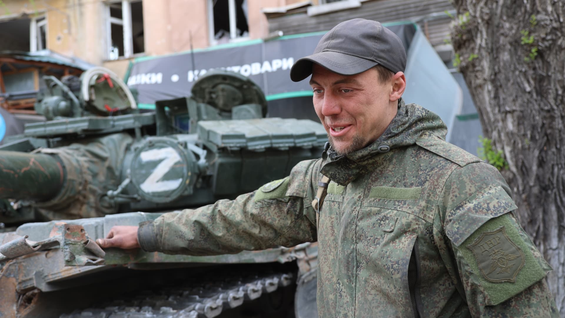A DPR army fighter is seen in front of the tank as Russian attacks continue in Mariupol, Ukraine on May 04, 2022.