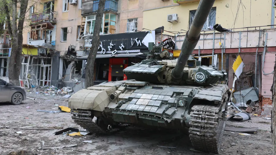 A tank is seen in front of the damaged building as Russian attacks continue in Mariupol, Ukraine on May 04, 2022.