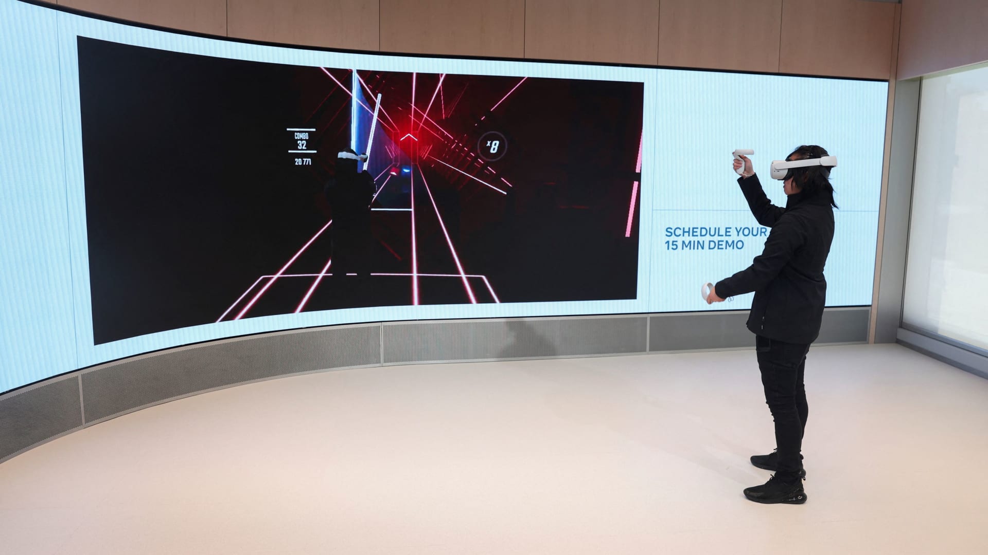Chris Nguyen, an experience expert, demonstrates the Quest Experience during a preview of the inaugural physical store of Facebook-owner Meta Platforms Inc in Burlingame, California, May 4, 2022.