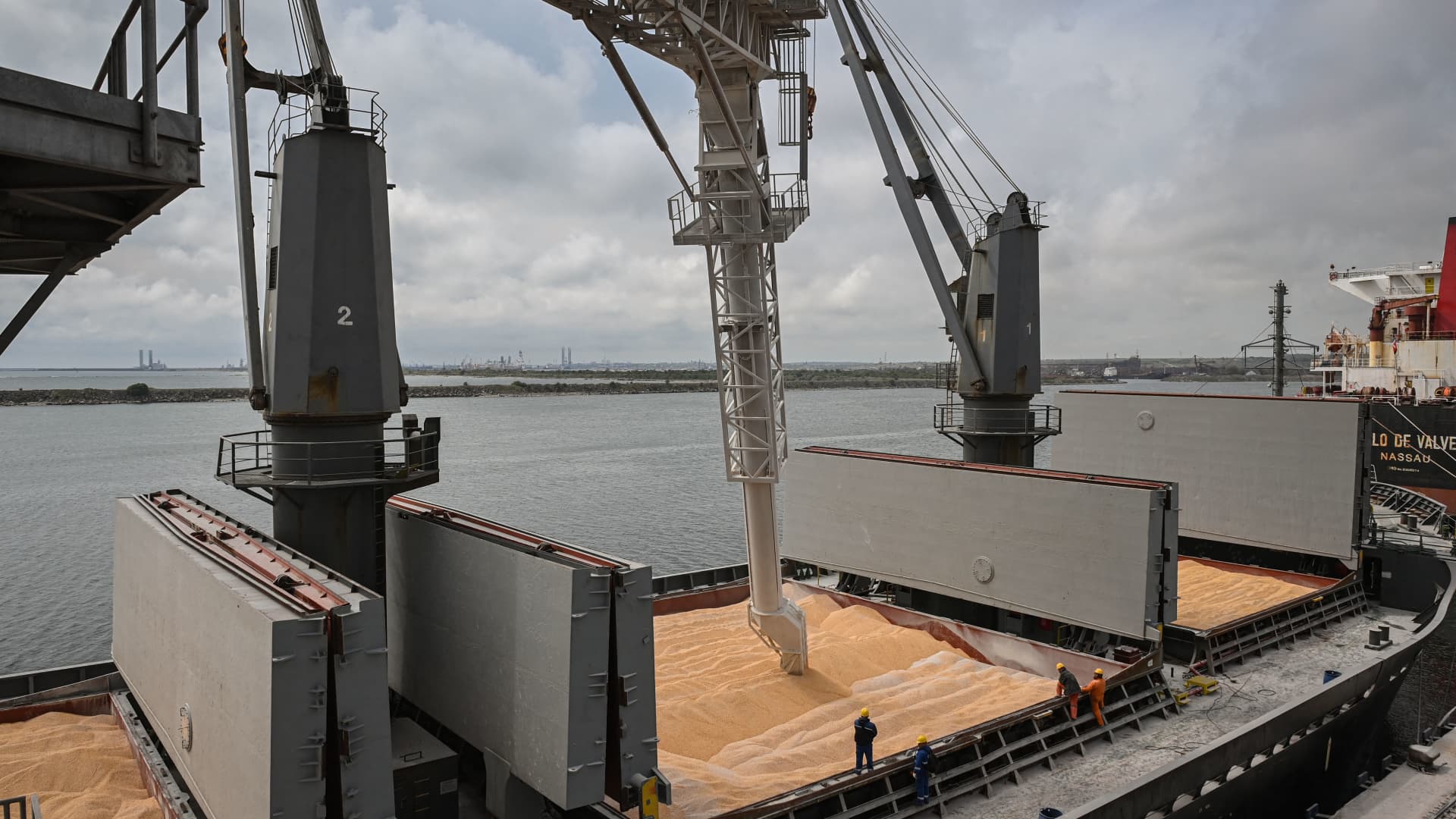 Workers assist the loading of corn onto a ship at Pier 80 in the Black Sea port of Constanta, Romania, on May 3, 2022. The Romanian port seeks to become an export hub for neighboring Ukraine after Russia's invasion cut off its sea routes.
