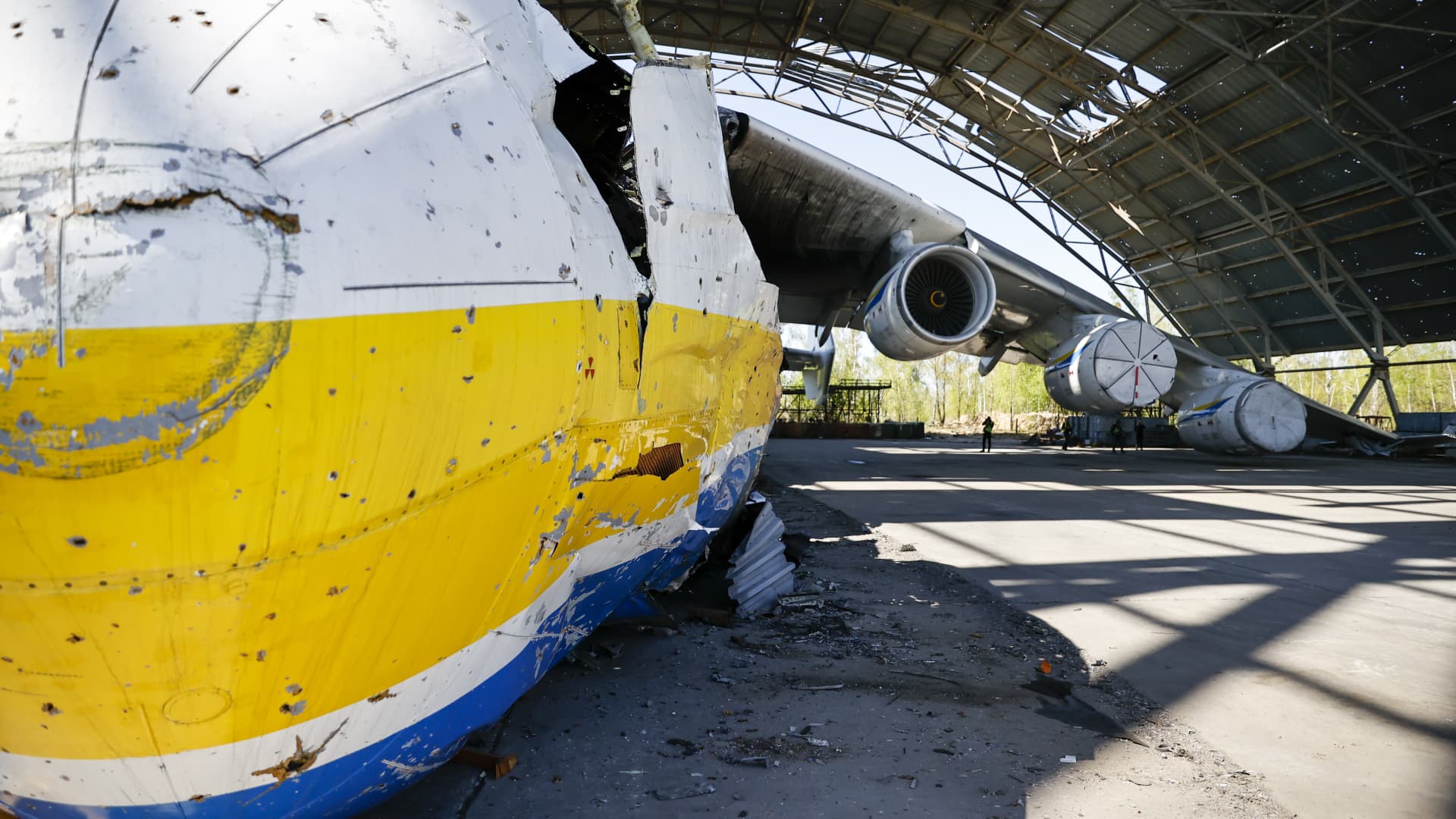 A view of the wreckage of the Antonov An-225 Mriya, the world's largest cargo plane, at an airshed after it was destroyed by Russia's attacks on Ukraine as cleaning works continue at Antonov Airport in Hostomel, Ukraine on May 5, 2022. 