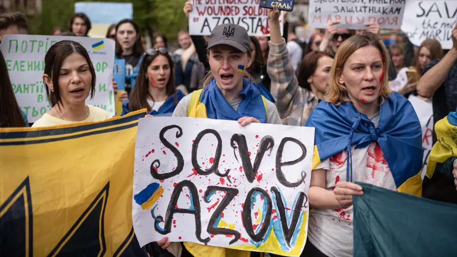 People hold banners and shout slogans during a demonstration in support of Mariupol defenders on May 3, 2022 in Kyiv, Ukraine.