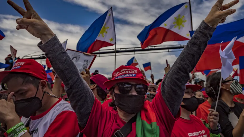 A supporter flashes the peace sign, the campaign symbol of Ferdinand Bongbong Marcos Jr., during his last campaign rally before the election on May 07, 2022 in Paranaque, Metro Manila, Philippines. Candidates for the May 9 presidential elections held their final campaign rallies two days before millions of Filipinos head to the polls to elect the country's new set of leaders. The son and namesake of ousted dictator Ferdinand Marcos Sr., who was accused and charged of amassing billions of dollars of ill-go