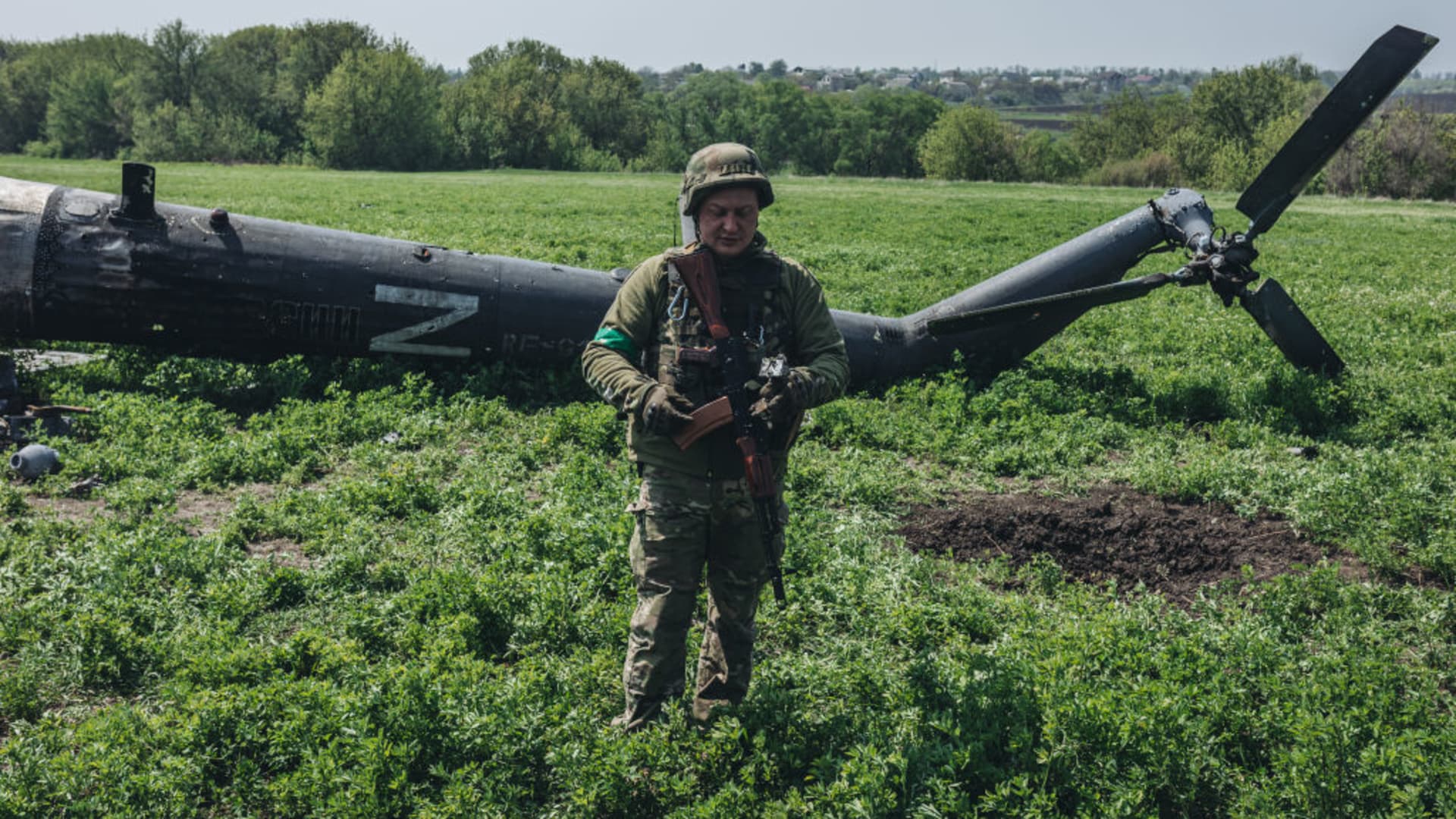 Ukrainian soldiers in a downed Russian helicopter in the outskirts of Kharkiv, Ukraine, 8 May 2022.