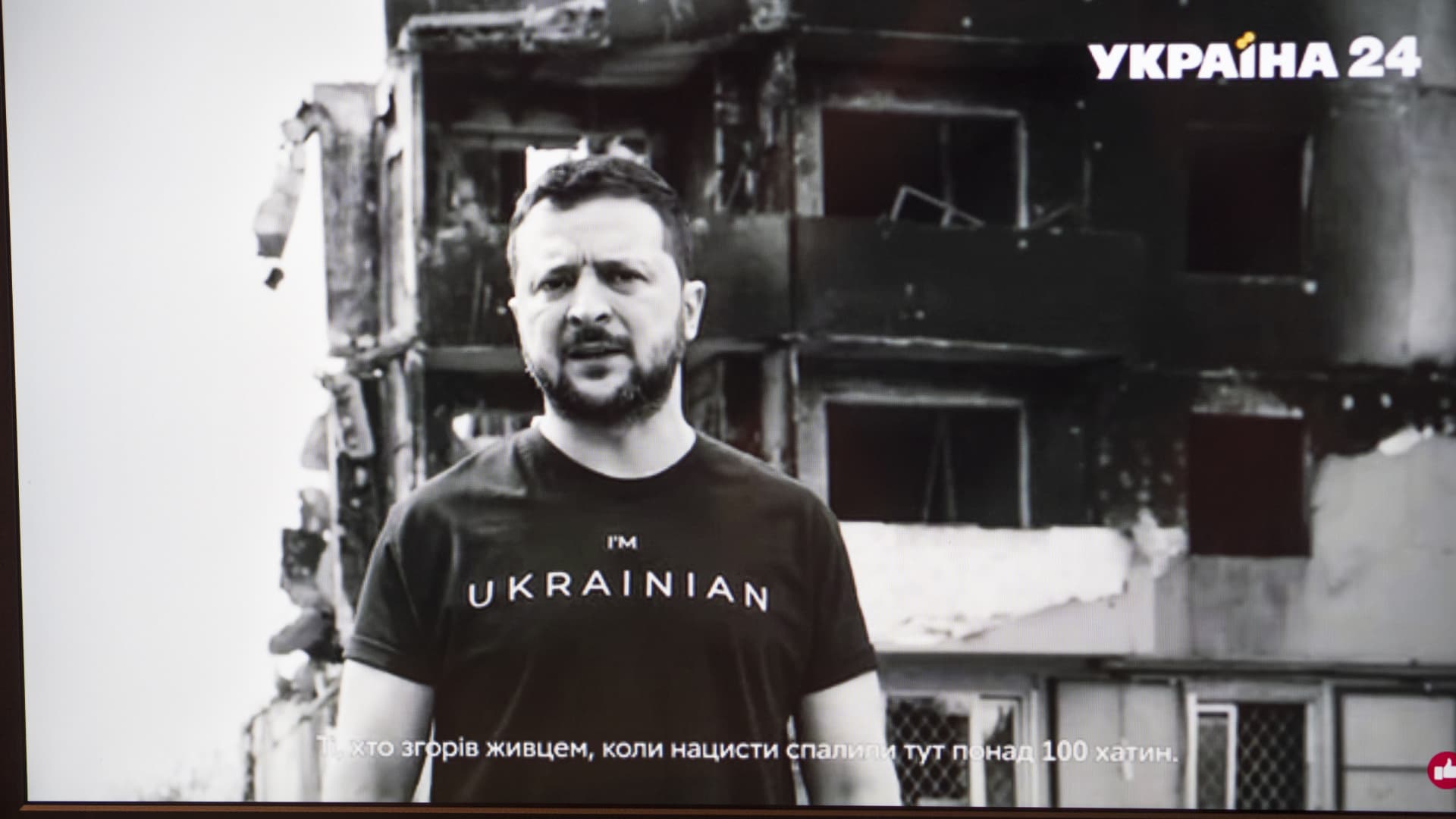 A screen grab of President of Ukraine Volodymyr Zelenskyy's address on the occasion of the Day of Remembrance and Reconciliation in Borodyanka near Kyiv against the backdrop of a house destroyed by Russian invaders.