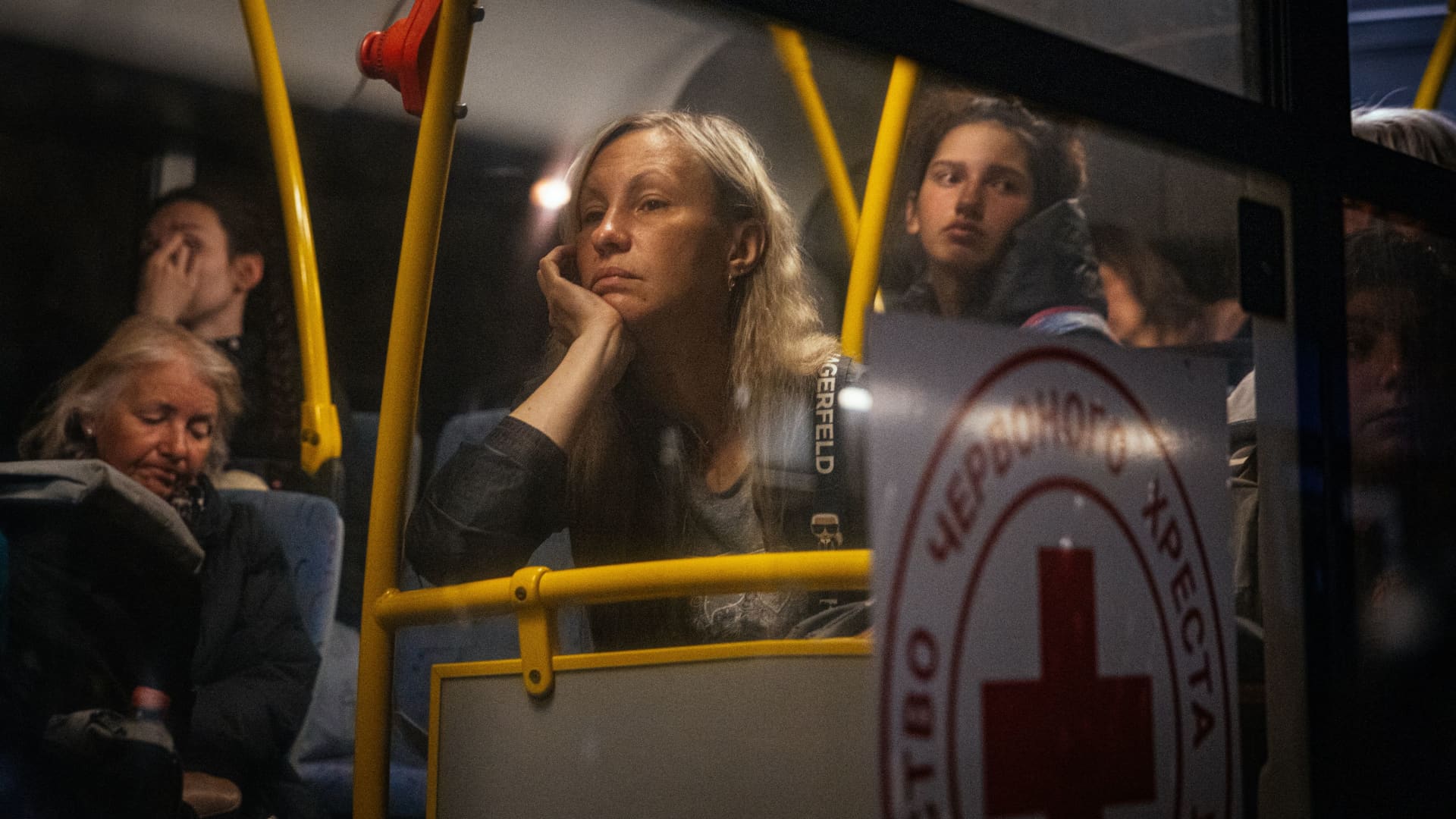 People evacuated from Mariupol arrive on buses at a registration and processing area for internally displaced people in Zaporizhzhia, on May 8, 2022.