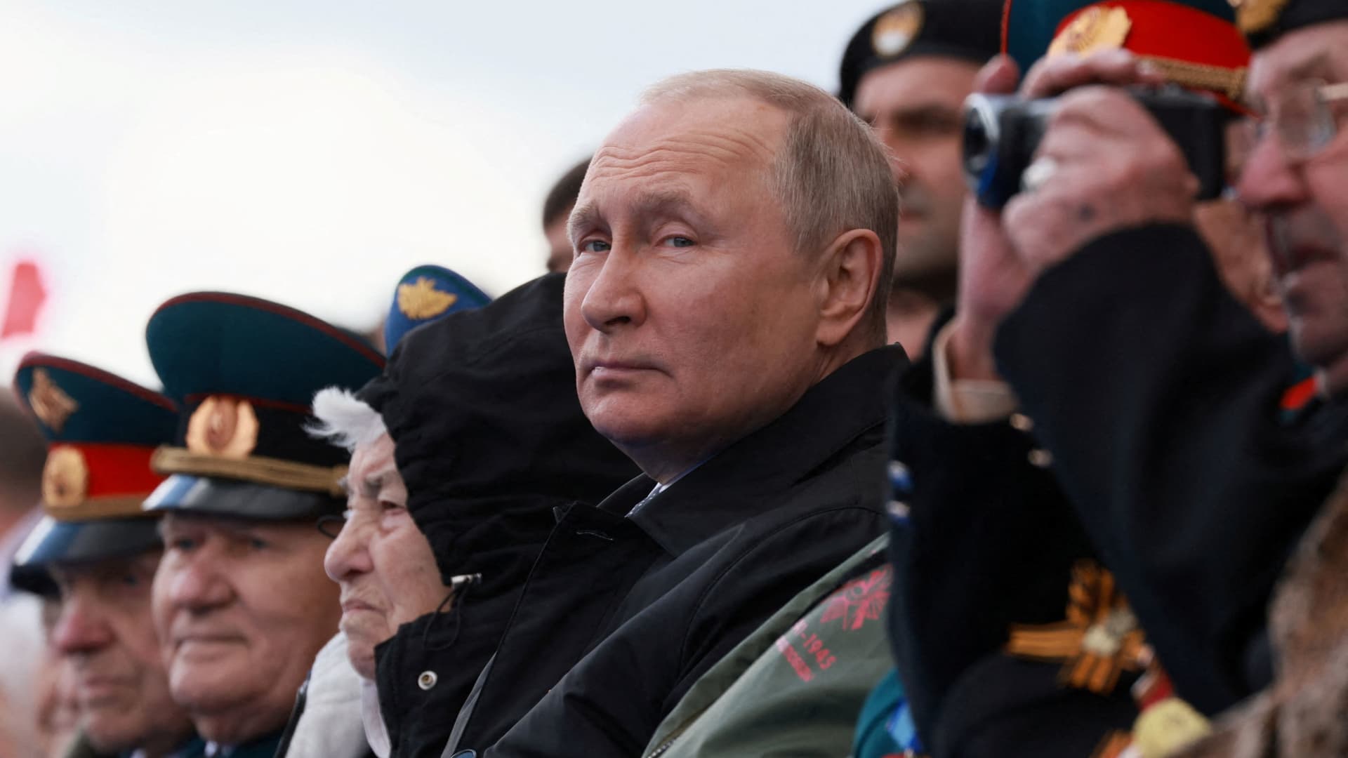 Russian President Vladimir Putin watches a military parade on Victory Day, which marks the 77th anniversary of the victory over Nazi Germany in World War Two, in Red Square in central Moscow, Russia May 9, 2022.
