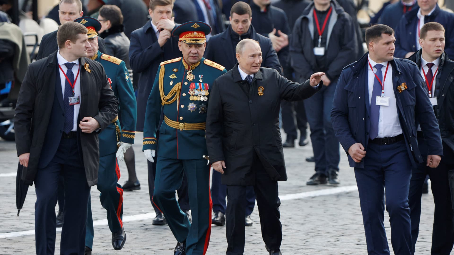 Russian President Vladimir Putin and Defence Minister Sergei Shoigu walk after a military parade on Victory Day, which marks the 77th anniversary of the victory over Nazi Germany in World War Two, in Red Square in central Moscow, Russia May 9, 2022. 