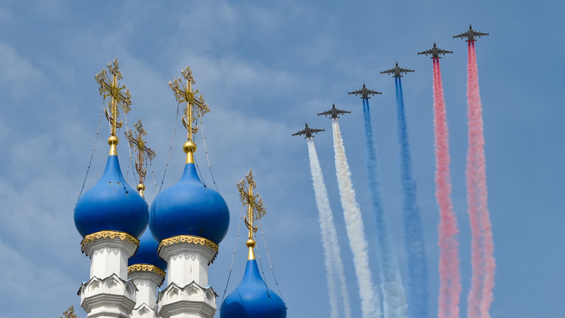 Russian Sukhoi Su-25 close air support jets fly over a church in a rehearsal of the Victory Day parade in Moscow, Russia, May 7, 2022.
